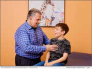 Dr. Salvador A. Bou-Gauthier MD engages with a patient during a consultation