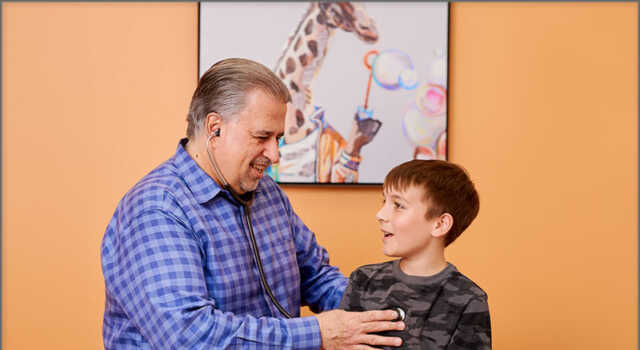 Dr. Salvador A. Bou-Gauthier MD engages with a patient during a consultation